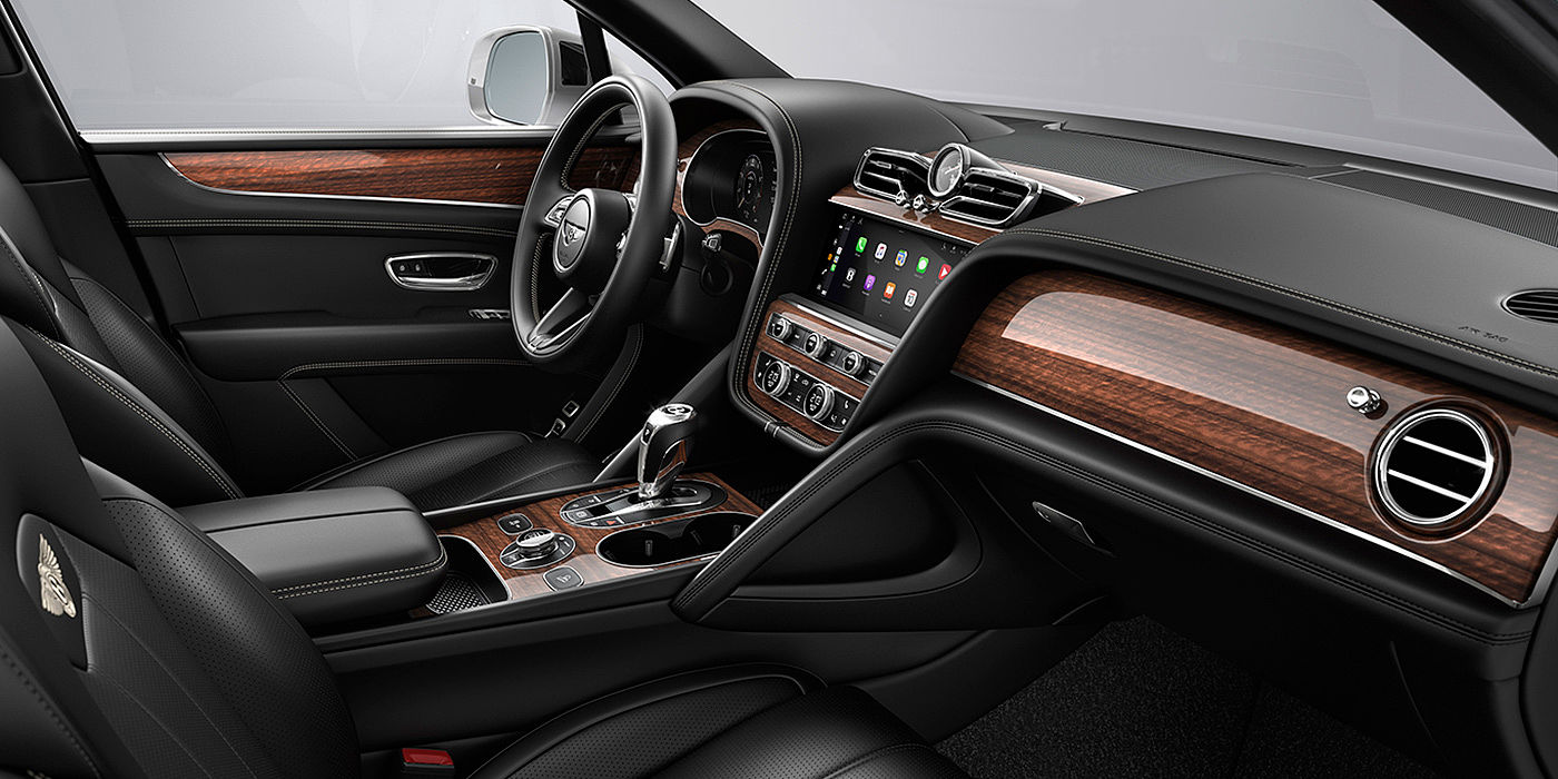 Bentley Adelaide Bentley Bentayga interior with a Crown Cut Walnut veneer, view from the passenger seat over looking the driver's seat.