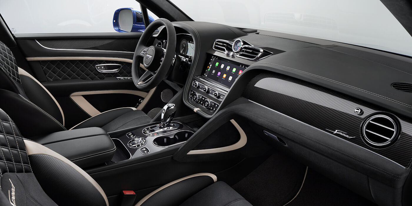 Bentley Adelaide Bentley Bentayga Speed SUV front interior in Beluga black and Linen hide with carbon fibre veneer