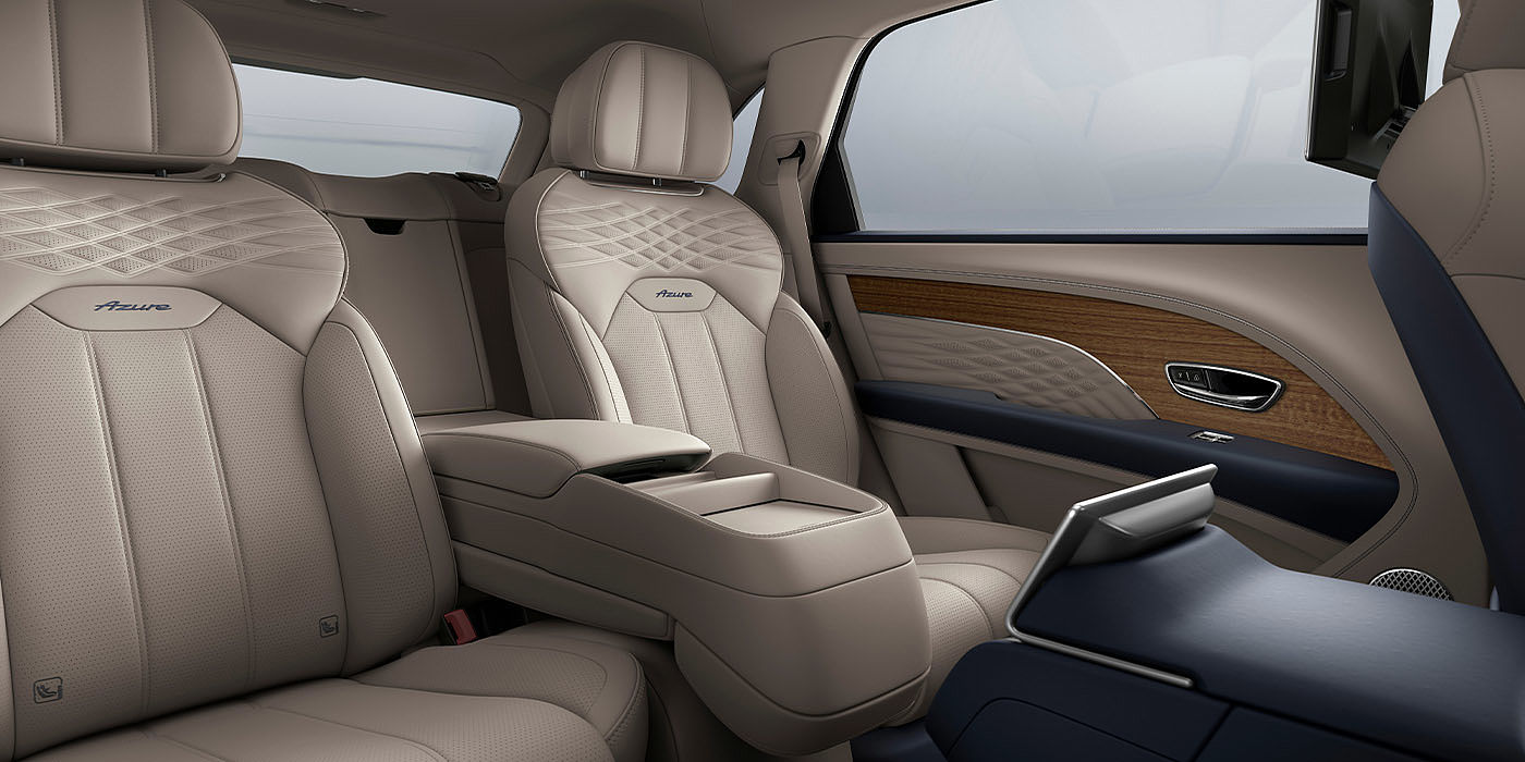 Bentley Adelaide Bentley Bentayga EWB Azure interior view for rear passengers with Portland hide featuring Azure Emblem in Imperial Blue contrast stitch.