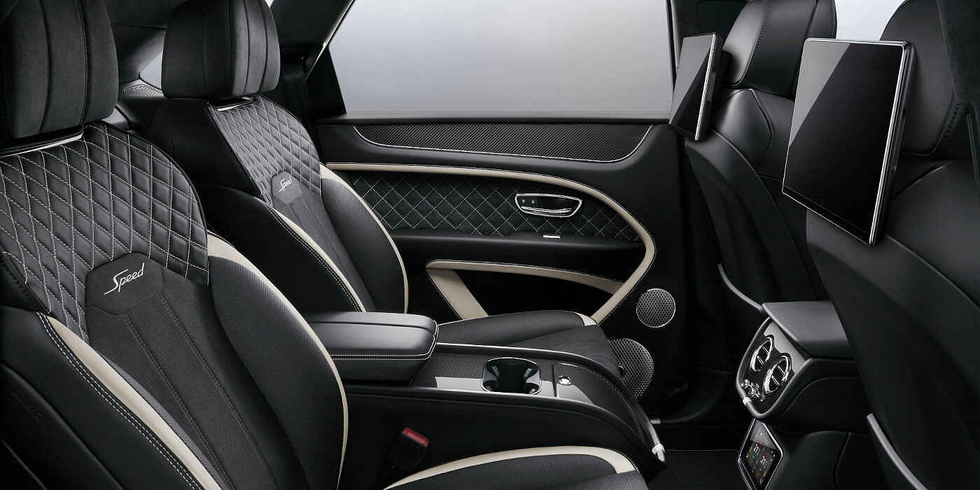 Bentley Adelaide Bentley Bentayga Speed SUV rear interior in Beluga black and Linen hide with carbon fibre veneer