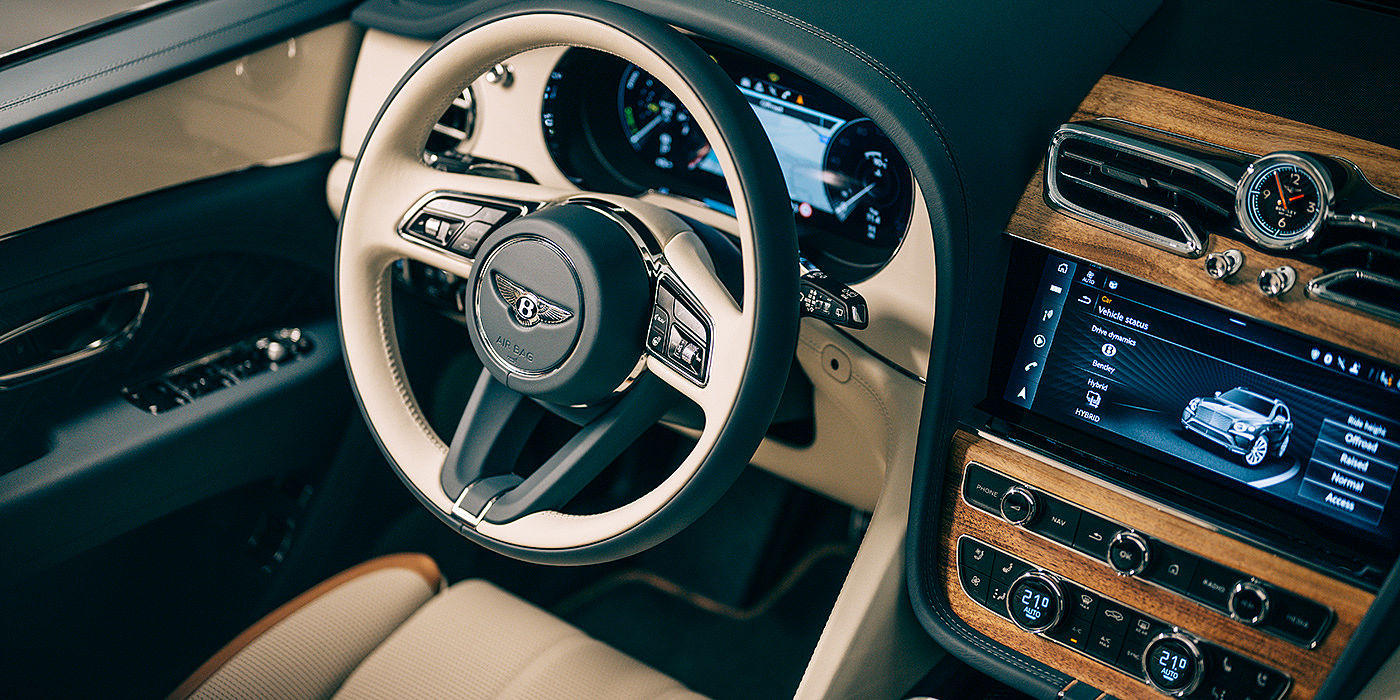 Bentley Adelaide Bentley Bentayga Odyssean Edition SUV front interior steering wheel in Linen and Brunel hide