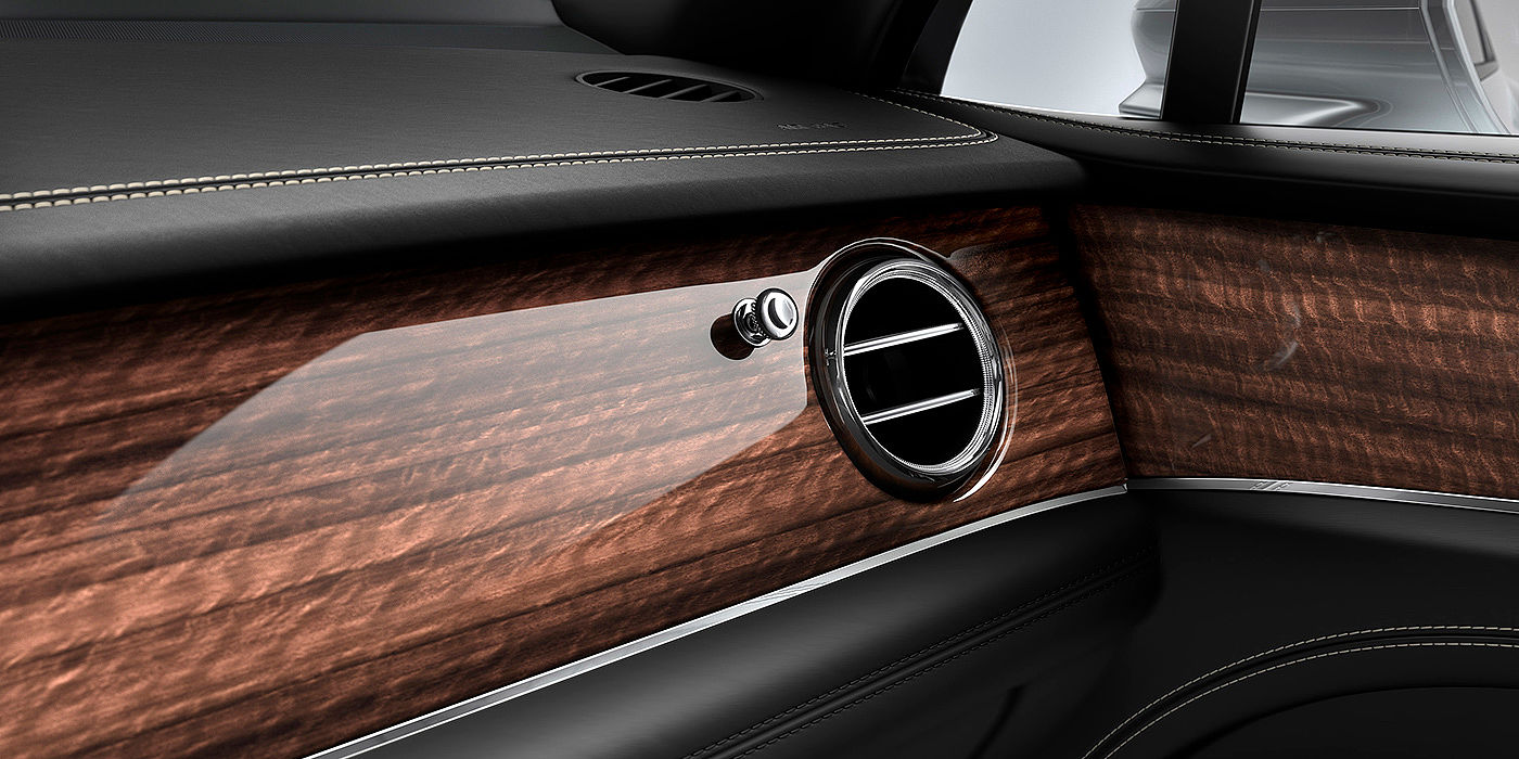Bentley Adelaide Bentley Bentayga front interior Crown Cut Walnut veneer and chrome air vent.