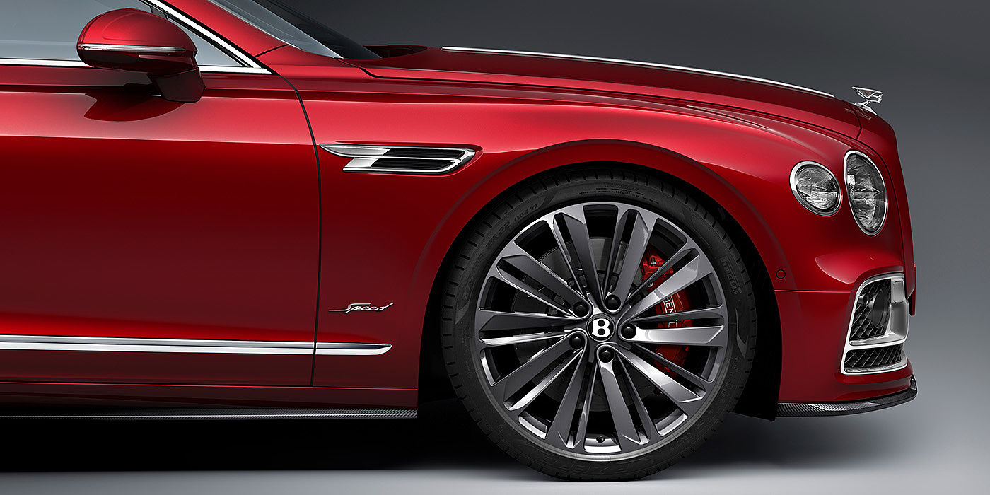 Bentley Adelaide Bentley Flying Spur Speed sedan front wheel in close up with Dragon Red II paint