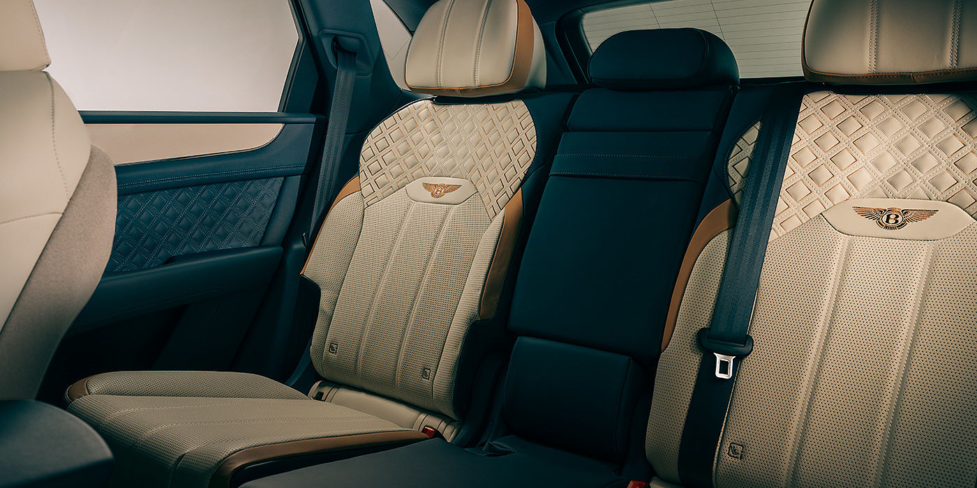 Bentley Adelaide Bentley Bentayga Odyssean Edition SUV rear interior in Linen and Brunel hides with diamond in diamond seat stitching